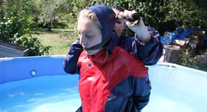 18 year old girl Megan Rain removes her sandals and then clothes to pose naked